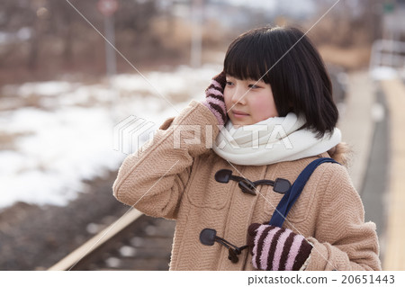 Girls junior high school students going to school by train 20651443