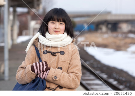 Girls junior high school students going to school by train 20651450