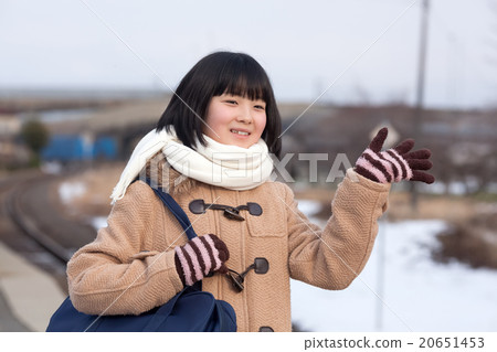 Girls junior high school students going to school by train 20651453