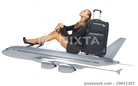 Businesswoman sitting on jet 20653307
