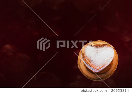 Heart shape ice and dark red background Heart shape ice and dark red background 20655814