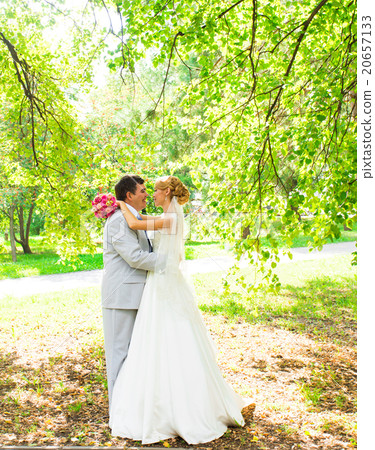 Bride and groom having a romantic moment on their Bride and groom having a romantic moment on their 20657133