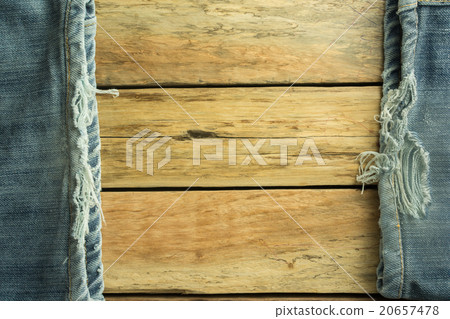 Jeans on a wooden floor 20657478