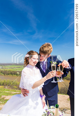 Bride and groom with champagne glasses in wedding Bride and groom with champagne glasses in wedding 20657499