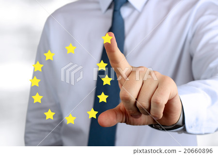 Business Man pushing on a European Union sign 20660896
