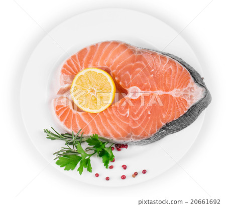 Raw salmon steak with lemon. 20661692