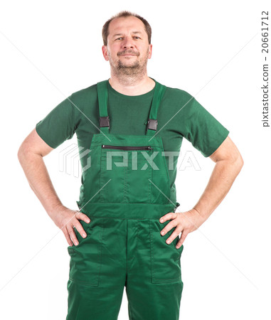 Worker in green overalls. Worker in green overalls. 20661712