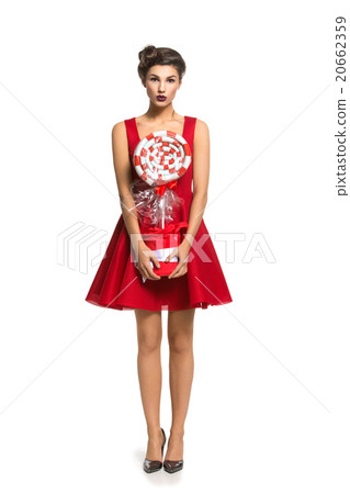Girl in red dress with big candy Girl in red dress with big candy 20662359