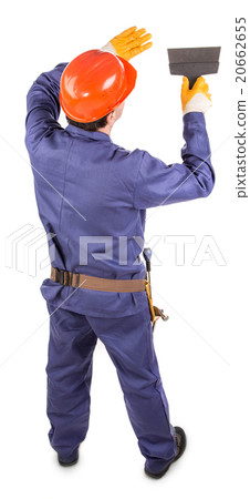 Worker in red protective helmet. Worker in red protective helmet. 20662655