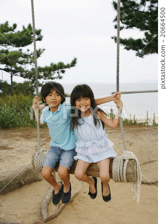 Children playing with hand-made swings 20664500