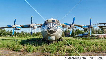 Old aircraft An-12 at an abandoned aerodrome 20667280