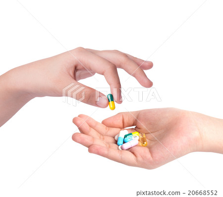 Drug capsules in hand with drinking water Drug capsules in hand with drinking water 20668552