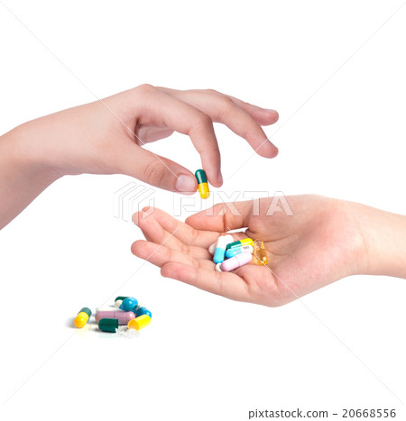 Drug capsules and pills in hand 20668556