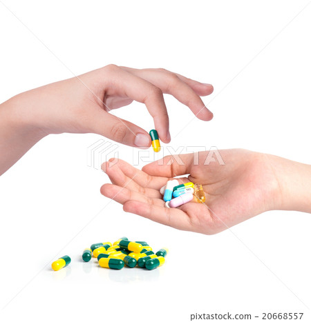 Drug capsules and pills in hand Drug capsules and pills in hand 20668557