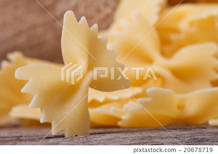 farfalle pasta macro dry on the old table farfalle pasta macro dry on the old table 20678719