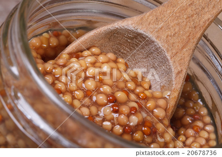 Dijon mustard on a wooden spoon Dijon mustard on a wooden spoon 20678736