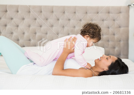 Brunette playing with her baby 20681336