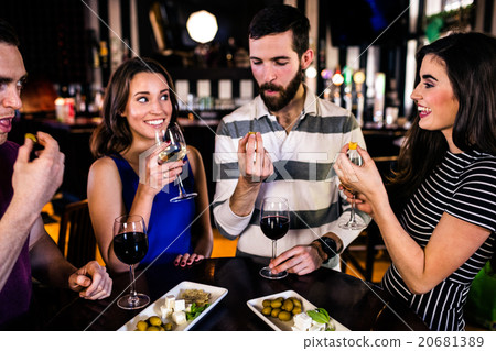 Friends having an aperitif with wine Friends having an aperitif with wine 20681389