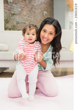 Mother with baby learning to walk Mother with baby learning to walk 20681619