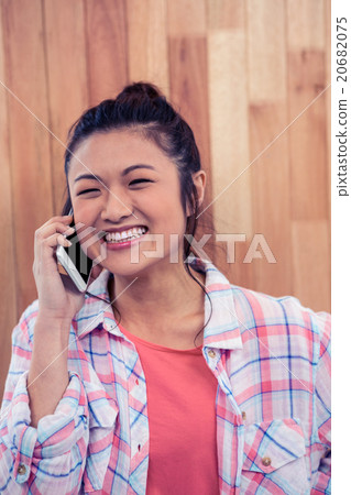 Happy Asian woman on phone call 20682075