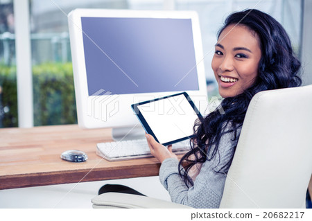 Smiling Asian woman using tablet 20682217