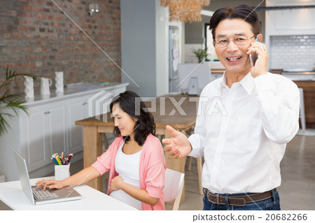 Smiling man on a phone call 20682266