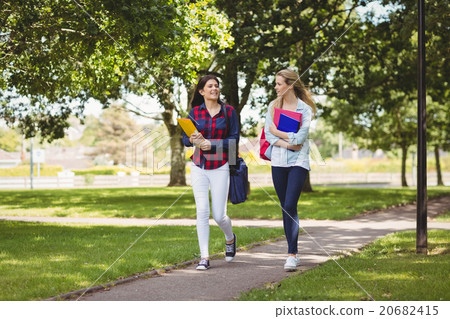 Smiling students holding binder Smiling students holding binder 20682415