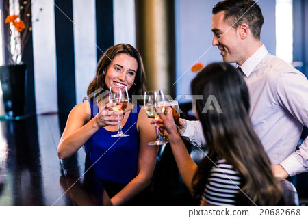 Friends toasting together 20682668