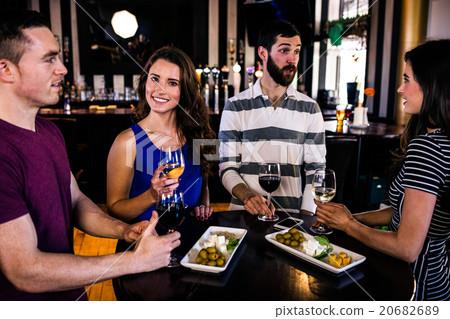 Friends having an aperitif with wine Friends having an aperitif with wine 20682689