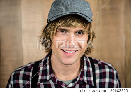 Smiling blond hipster staring at camera Smiling blond hipster staring at camera 20682803