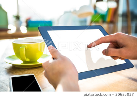 Cropped image of hipster businessman using tablet Cropped image of hipster businessman using tablet 20683037