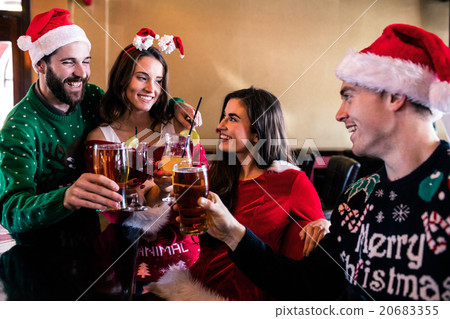 Festive friends drinking beer and cocktail Festive friends drinking beer and cocktail 20683355