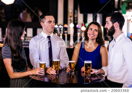 Friends talking and having a beer Friends talking and having a beer 20683368
