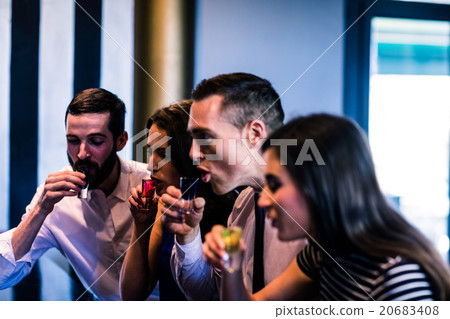 Friends drinking alcohol shots 20683408