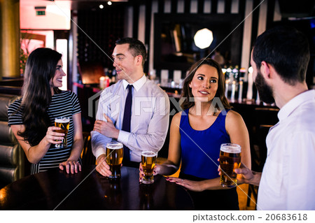 Friends talking and having a beer 20683618