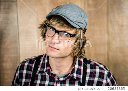 Serious blond hipster staring 20683865