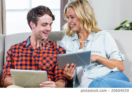 Couple using tablet computers 20684039