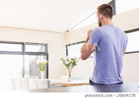 Rear view of handsome man drinking coffee Rear view of handsome man drinking coffee 20684176