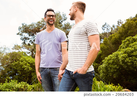 Smiling gay couple looking at each other 20684203