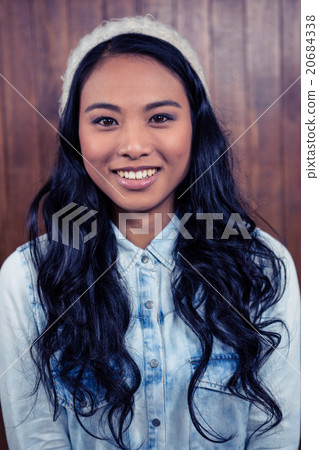 Asian woman smiling to the camera Asian woman smiling to the camera 20684338