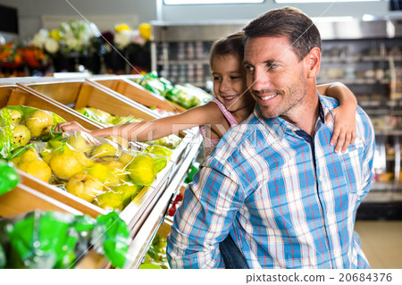 Father giving piggy back to daughter 20684376