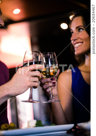 Couple toasting with a glass of wine 20684467