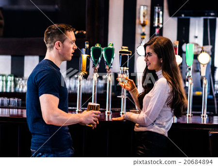 Cute couple talking in a bar 20684894