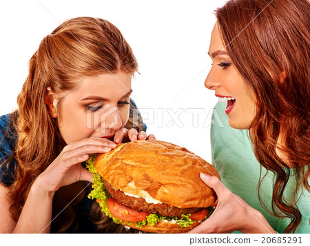 Girl eating big sandwich. 20685291