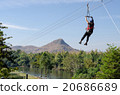 Woman on a jungle zipline adventure 20686689