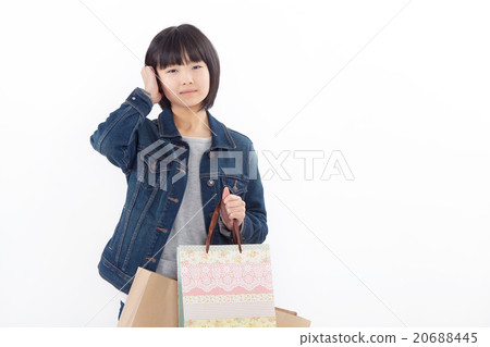 A girl who seems to be happy shopping a lot 20688445