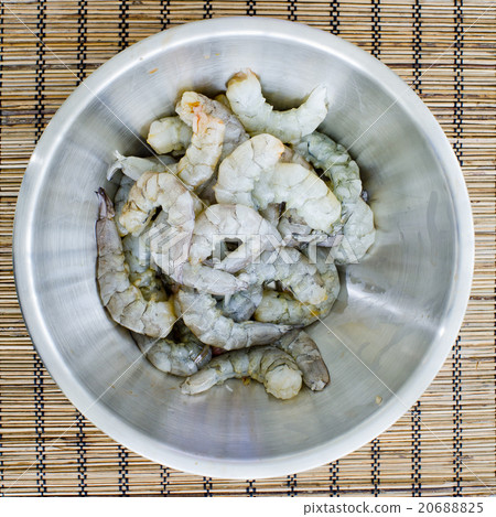 raw prawns in a white bowl without a marinate 20688825