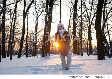 attractive young woman (Girl) playing with snow attractive young woman (Girl) playing with snow 20692695