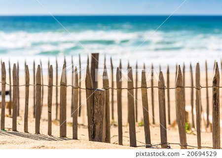 Wooden fence on an Atlantic beach in France Wooden fence on an Atlantic beach in France 20694529