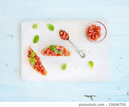 Tomato and basil bruschetta sandwich on white Tomato and basil bruschetta sandwich on white 20696700